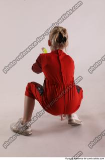 DENISA SITTING POSE WITH GUN